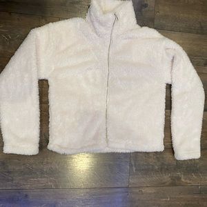 Cream colored fluffy jacket. Size XS copper key.